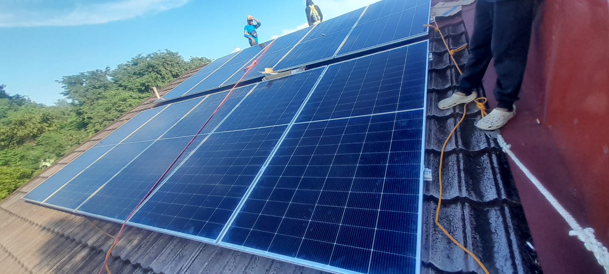 Ardyuron Solar team installing solar panels